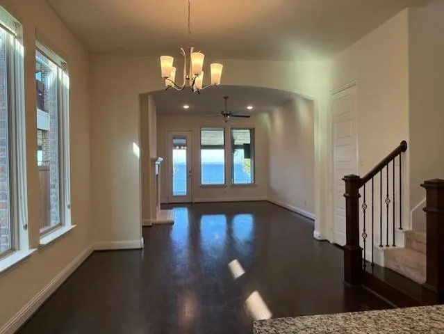 a view of a livingroom with wooden floor and fireplace