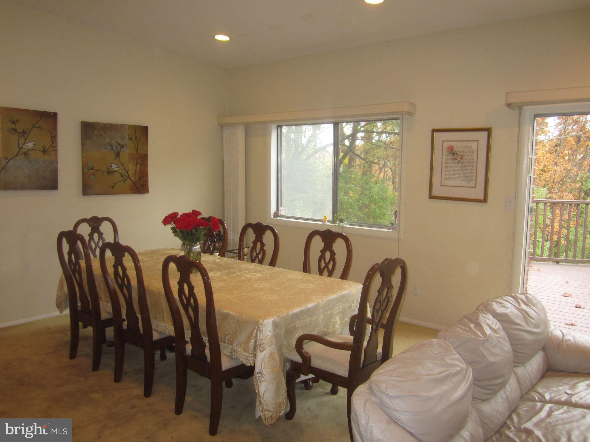 2313 Rogene Drive Baltimore, MD 21209 - Photo 3 of 5 a view of a dining room with furniture and a large window