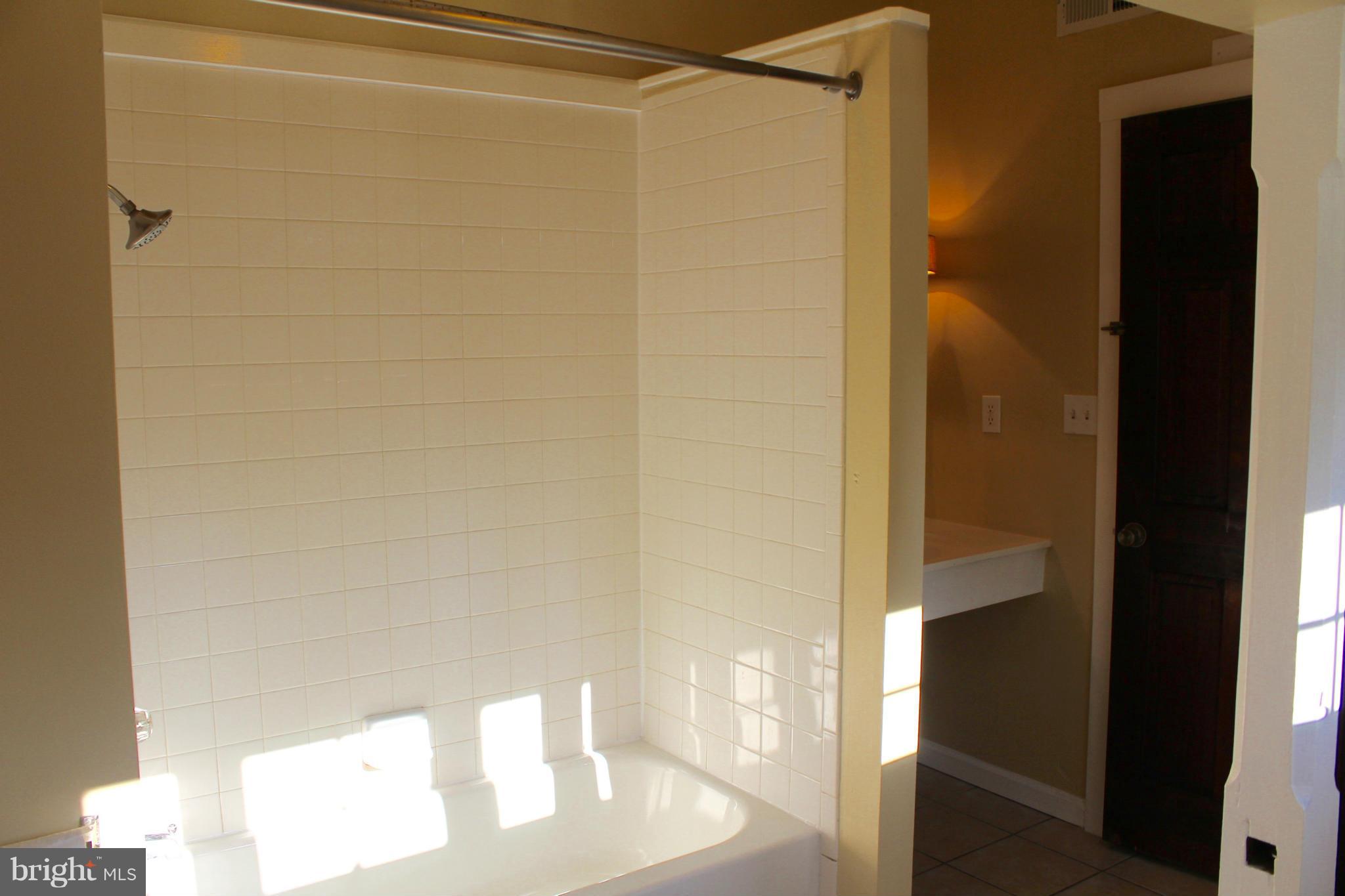 3650 Golf Course Road Martinsburg, WV 25405 - Photo 12 of 16 a bathroom with a glass shower door