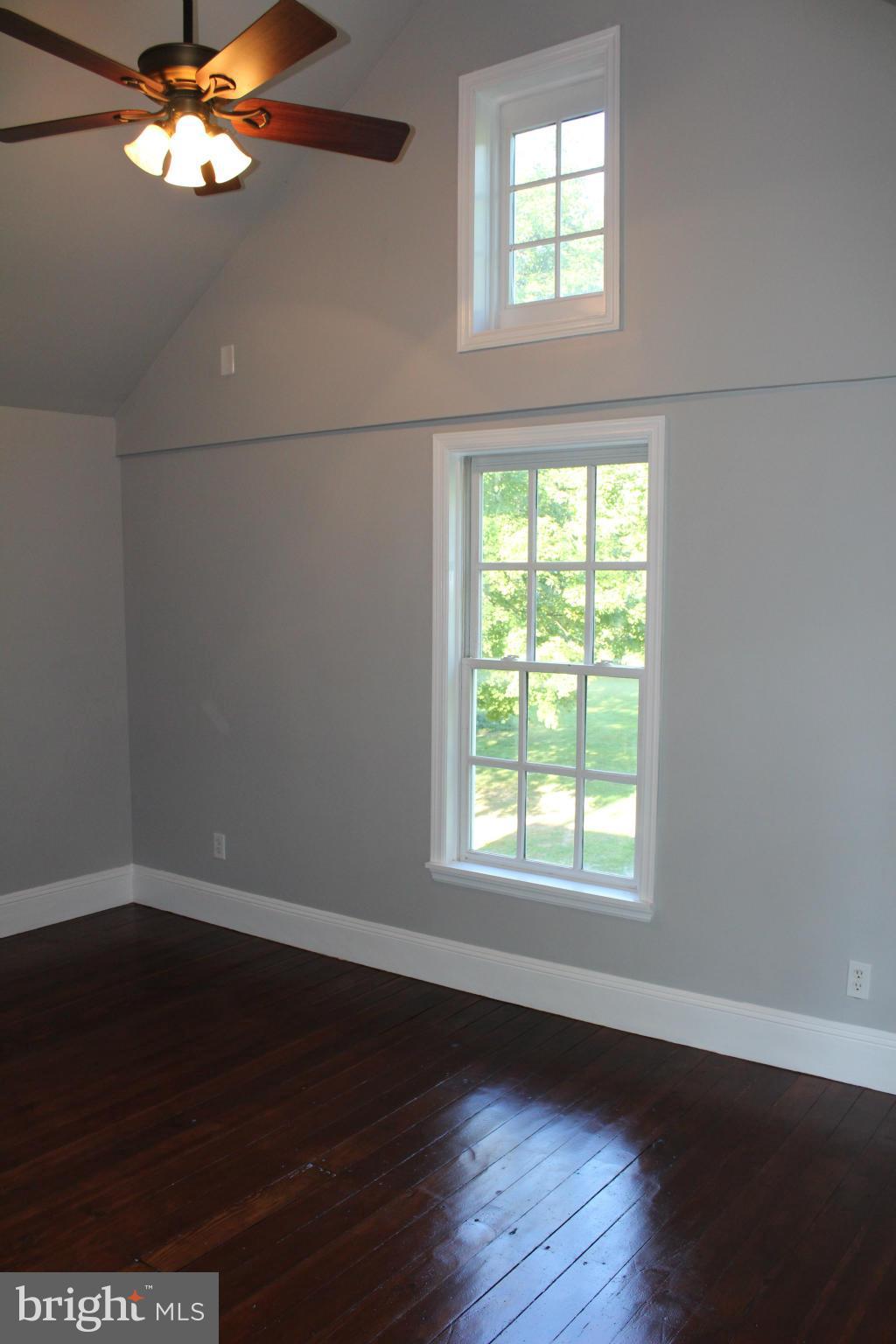 3650 Golf Course Road Martinsburg, WV 25405 - Photo 14 of 16 a view of an empty room with wooden floor and a window