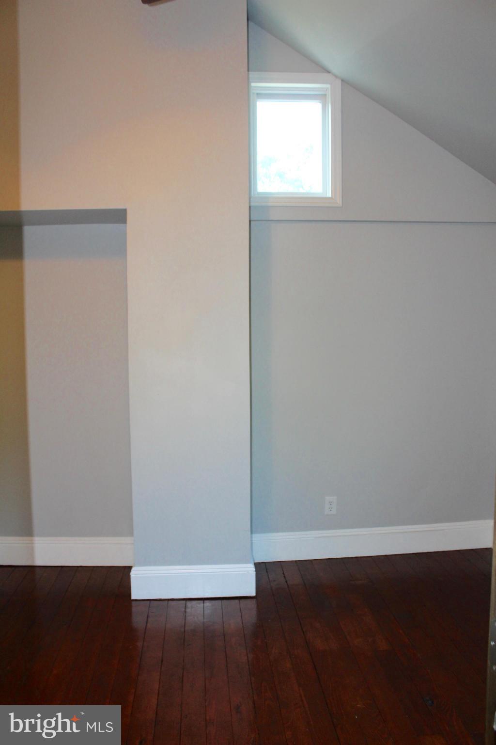 3650 Golf Course Road Martinsburg, WV 25405 - Photo 15 of 16 a view of an empty room with wooden floor and a window