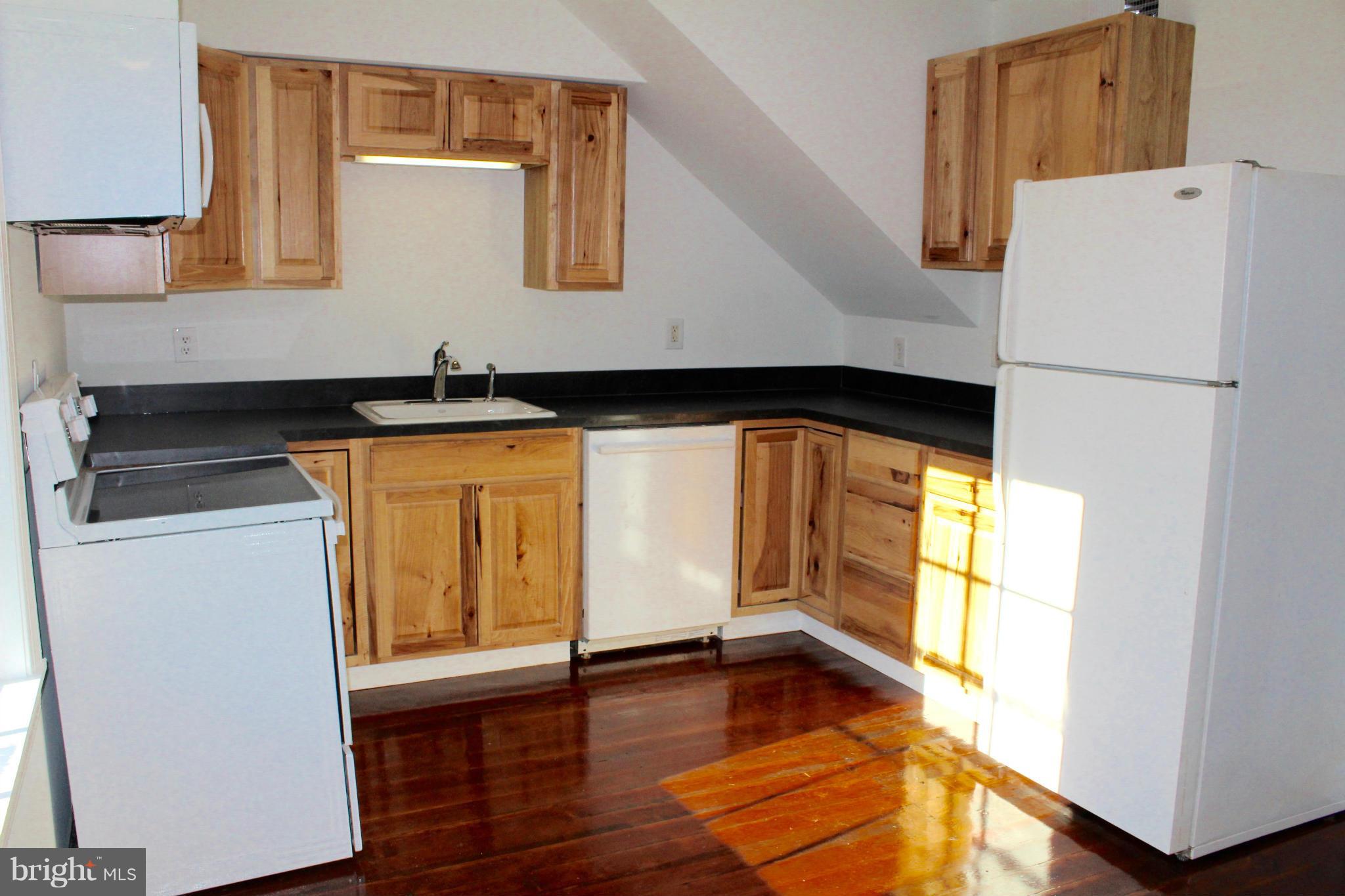 3650 Golf Course Road Martinsburg, WV 25405 - Photo 6 of 16 a kitchen with a refrigerator and a stove