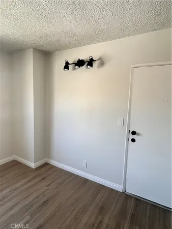 an empty room with wooden floor