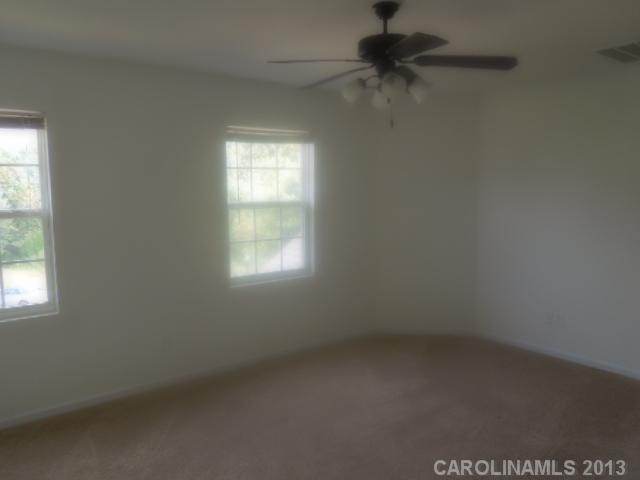 15509 Rathangan Drive Charlotte, NC 28273 - Photo 4 of 13 an empty room with a window