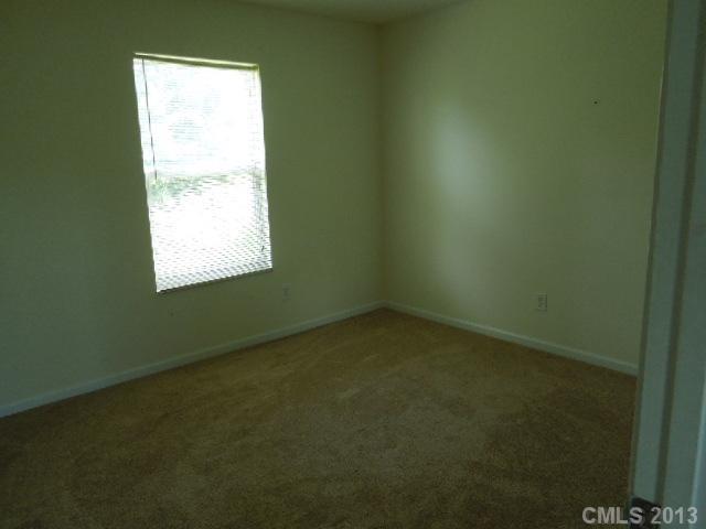 15509 Rathangan Drive Charlotte, NC 28273 - Photo 6 of 13 a view of an empty room with a window