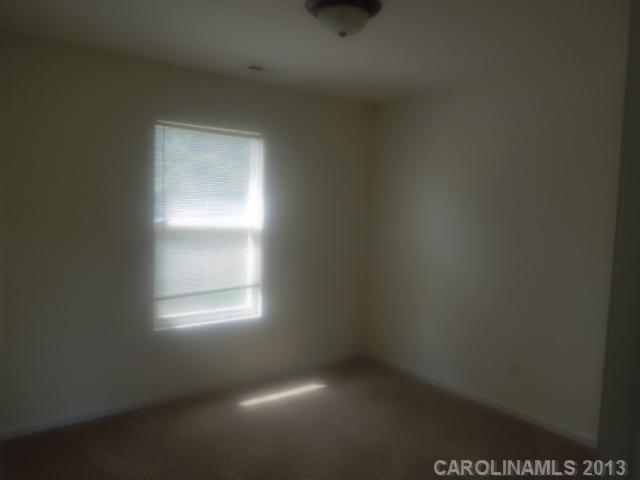 15509 Rathangan Drive Charlotte, NC 28273 - Photo 8 of 13 a view of an empty room and window