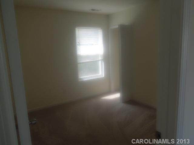 15509 Rathangan Drive Charlotte, NC 28273 - Photo 9 of 13 a view of empty room with window
