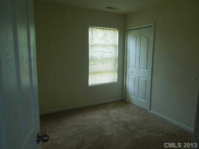 15509 Rathangan Drive Charlotte, NC 28273 - Photo 10 of 13 a view of an empty room with a window