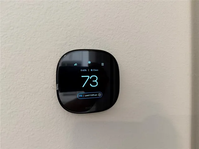 a view of entryway and kitchen