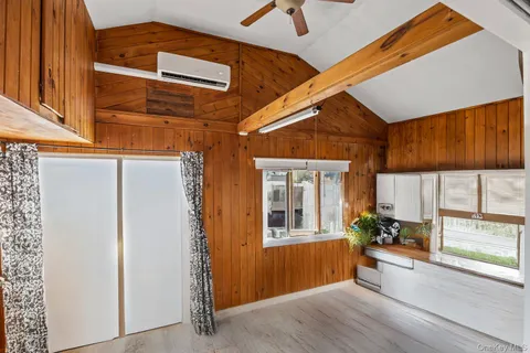 a kitchen with a stove a refrigerator and a dining table