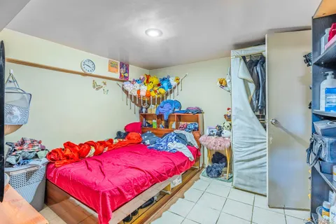 a bathroom with a granite countertop sink toilet a mirror a vanity and shower