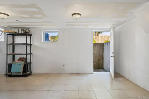 a view of livingroom with furniture and workspace