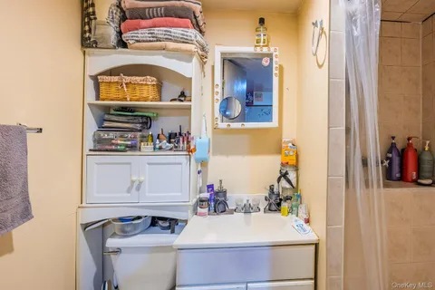 a view of room with window and furniture