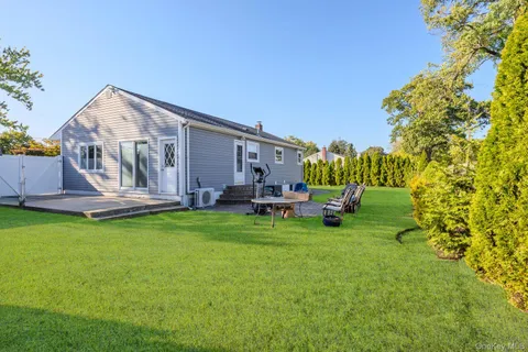 a view of swimming pool with outdoor seating and yard