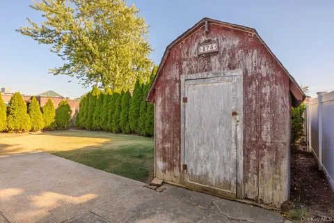 a view of a wooden door in front of house