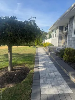 a view of a patio with a yard