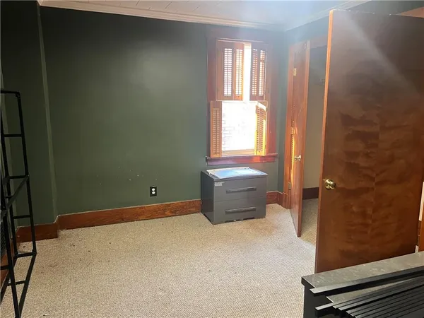 a bathroom with a shower and a sink