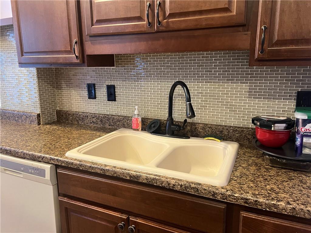 153 Locust Street Ambridge, PA 15003 - Photo 6 of 19 a bathroom with a granite countertop sink and a granite counter top