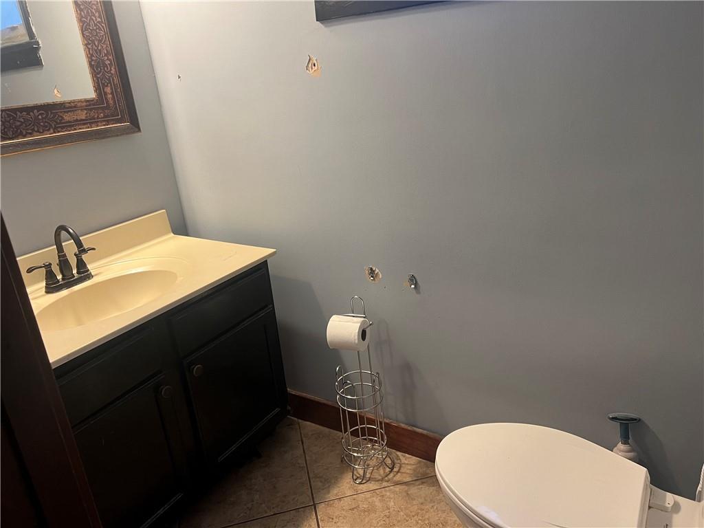 153 Locust Street Ambridge, PA 15003 - Photo 8 of 19 a bathroom with a sink a toilet and mirror
