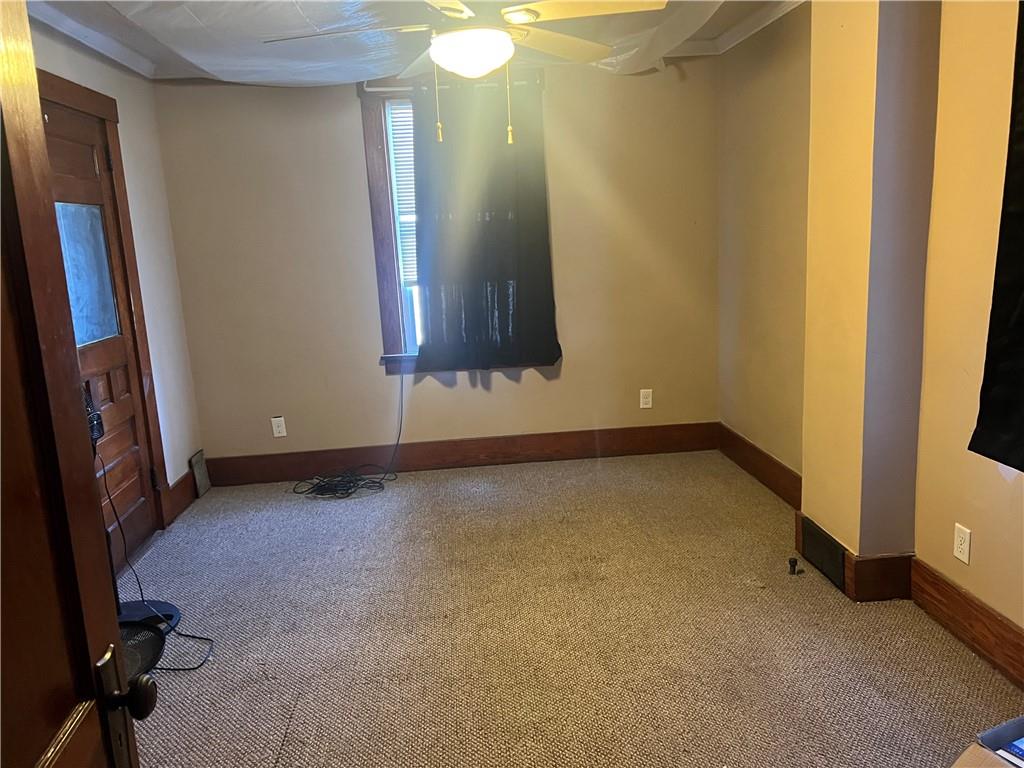 153 Locust Street Ambridge, PA 15003 - Photo 10 of 19 a view of an empty room with wooden floor and a window