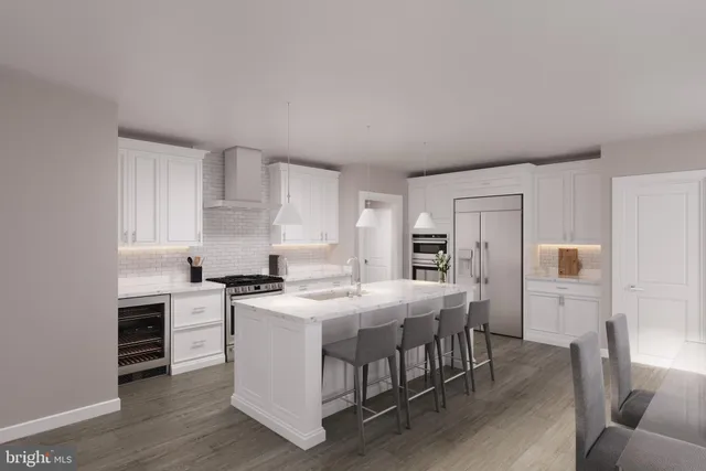 a kitchen that has a table and chairs in it