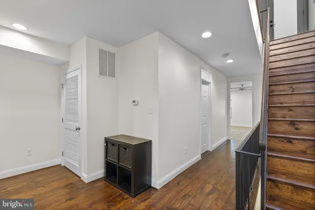 a view of walk in closet with empty racks