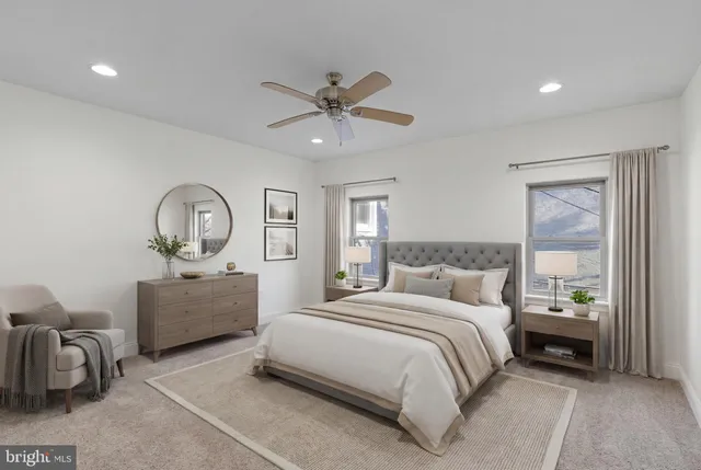 a bedroom with bed and window