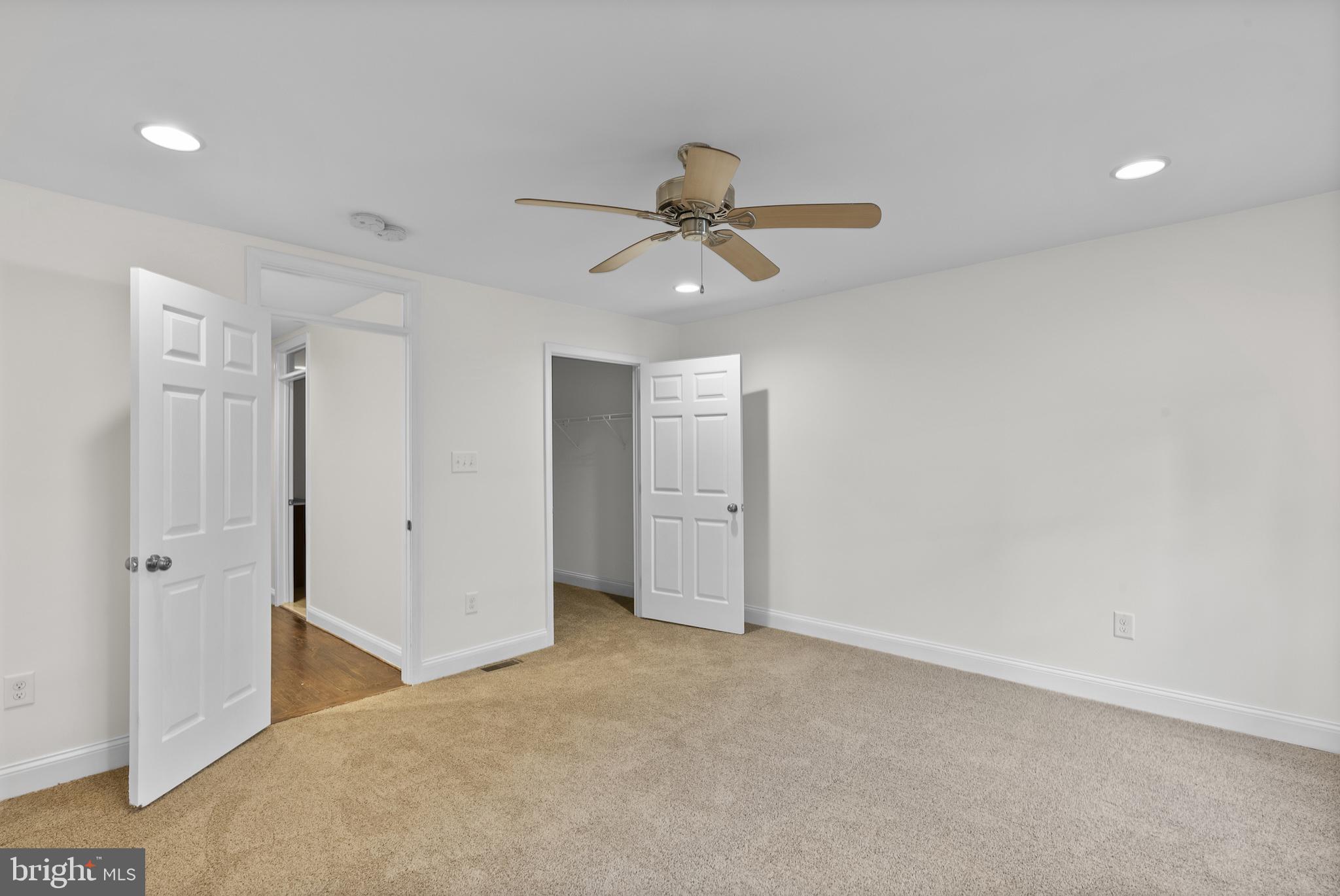 402 East Fort Avenue Baltimore, MD 21230 - Photo 16 of 35 an empty room with closet and a ceiling fan