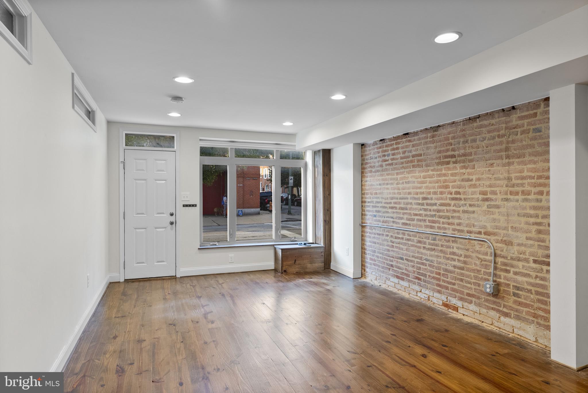 402 East Fort Avenue Baltimore, MD 21230 - Photo 18 of 35 a view of empty room with wooden floor