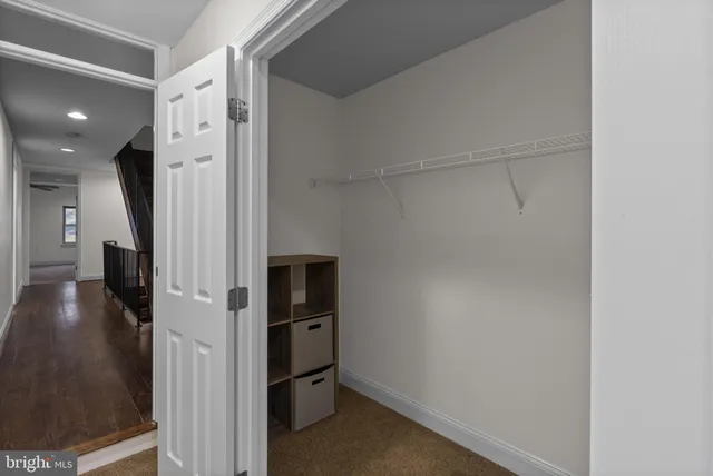 a view of a hallway with a room