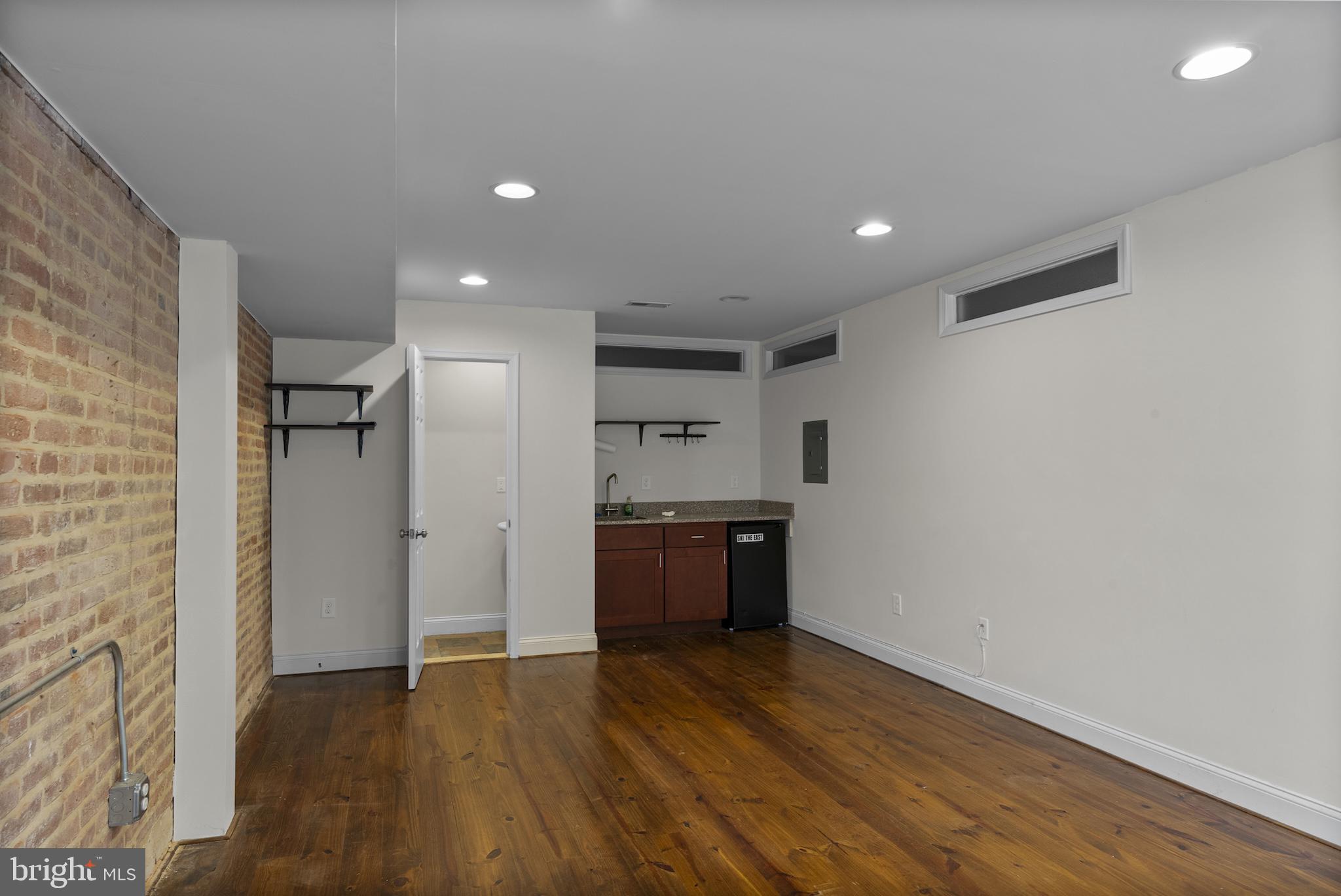 402 East Fort Avenue Baltimore, MD 21230 - Photo 26 of 35 a view of a kitchen with a sink and a refrigerator
