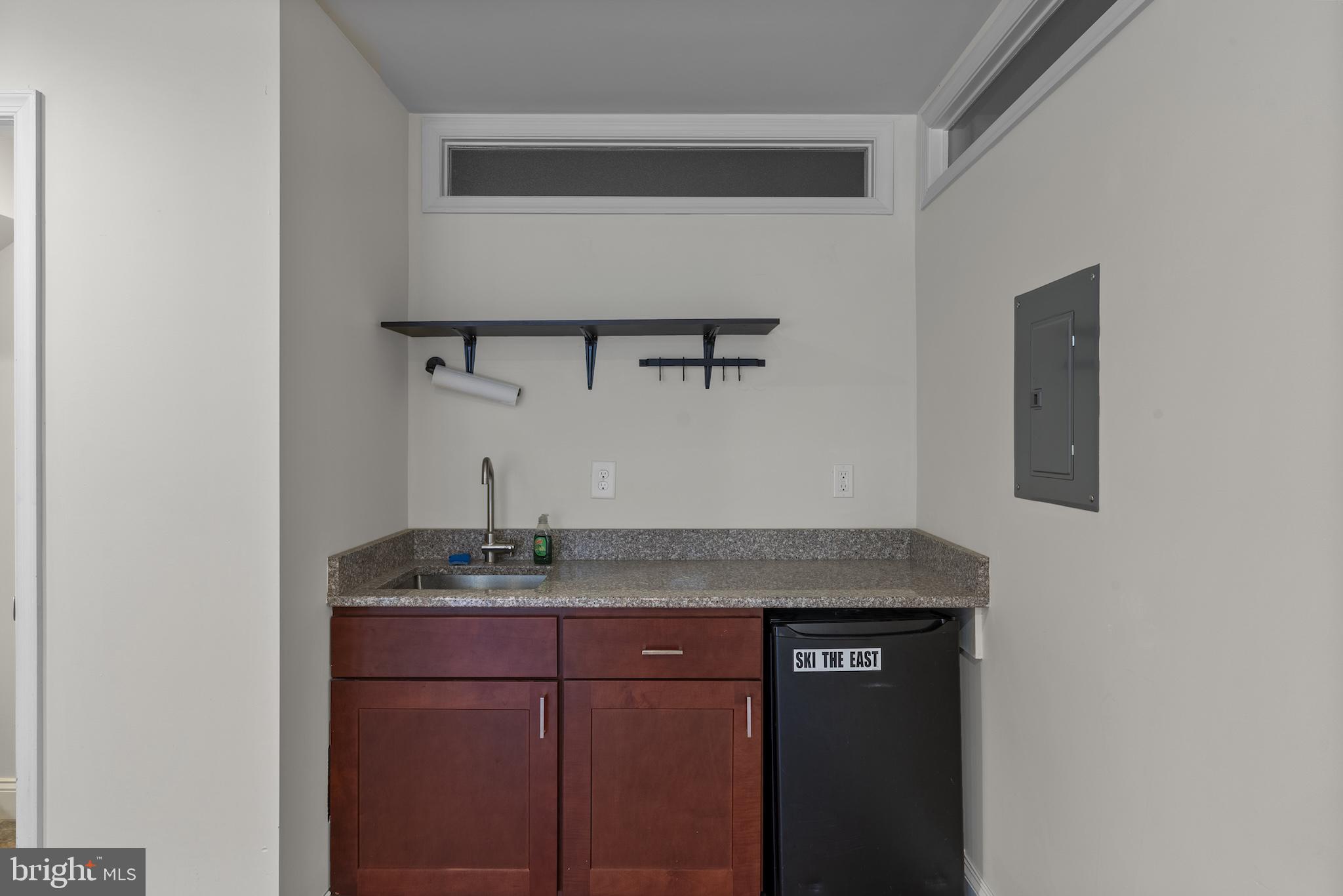 402 East Fort Avenue Baltimore, MD 21230 - Photo 27 of 35 a bathroom with a granite countertop sink and vanity