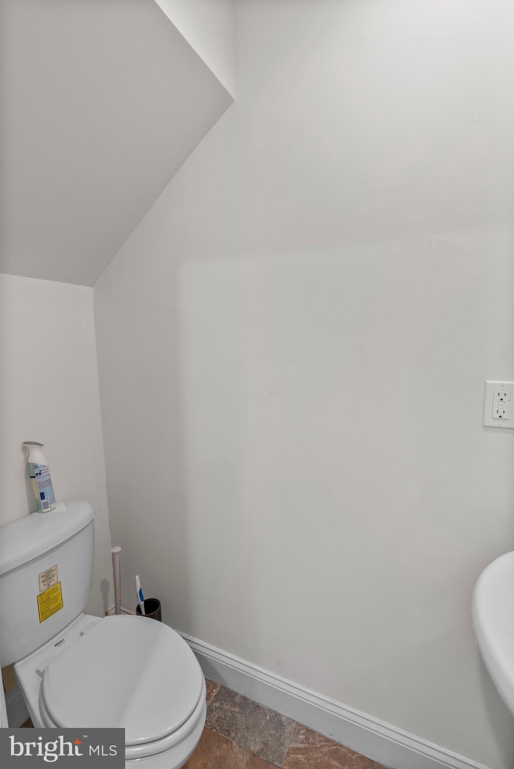 402 East Fort Avenue Baltimore, MD 21230 - Photo 28 of 35 a white toilet sitting next to a bathroom sink and vanity