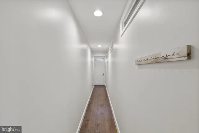 a view of a hallway with closet