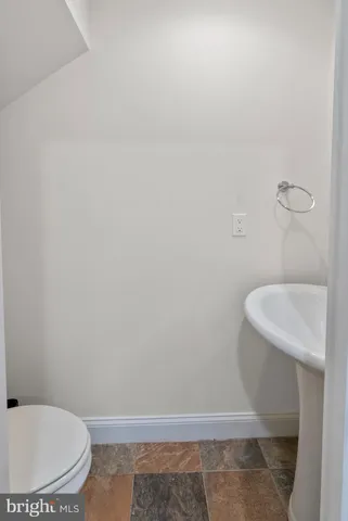 a bathroom with a toilet and a sink