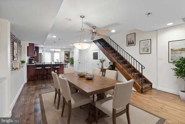 a dining room with furniture and entryway