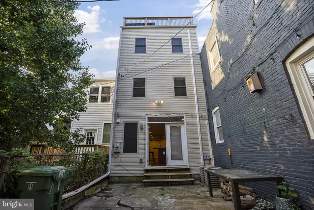 a front view of a house with stairs