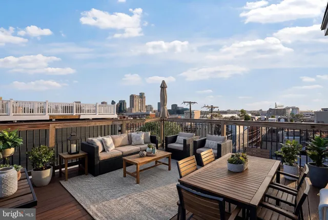 a terrace with wooden benches
