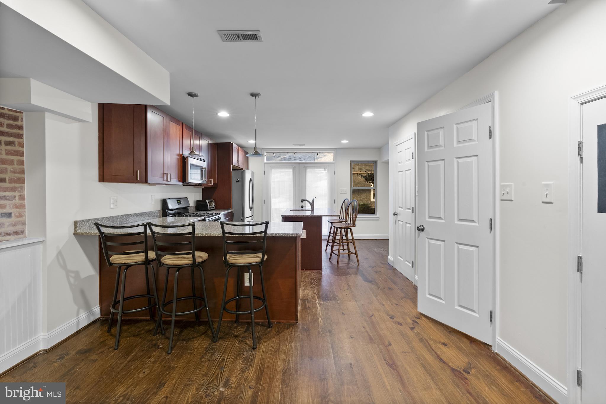 402 East Fort Avenue Baltimore, MD 21230 - Photo 6 of 35 a view of a dining room with furniture and wooden floor