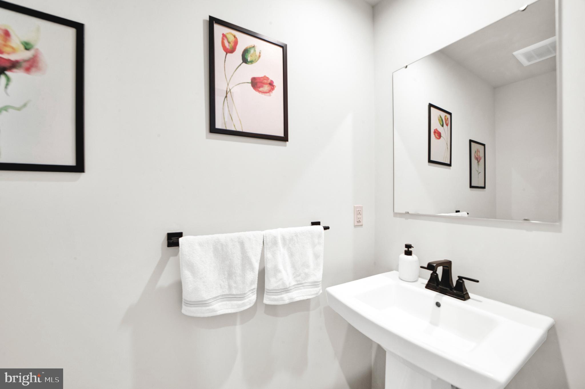 15 Pratt Lane Lawrence Township, NJ 08648 - Photo 11 of 31 a bathroom with a sink and a mirror