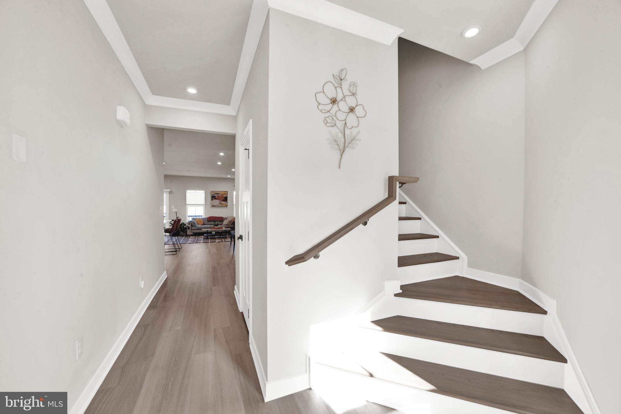 15 Pratt Lane Lawrence Township, NJ 08648 - Photo 12 of 31 a view of a hallway with wooden floor and staircase