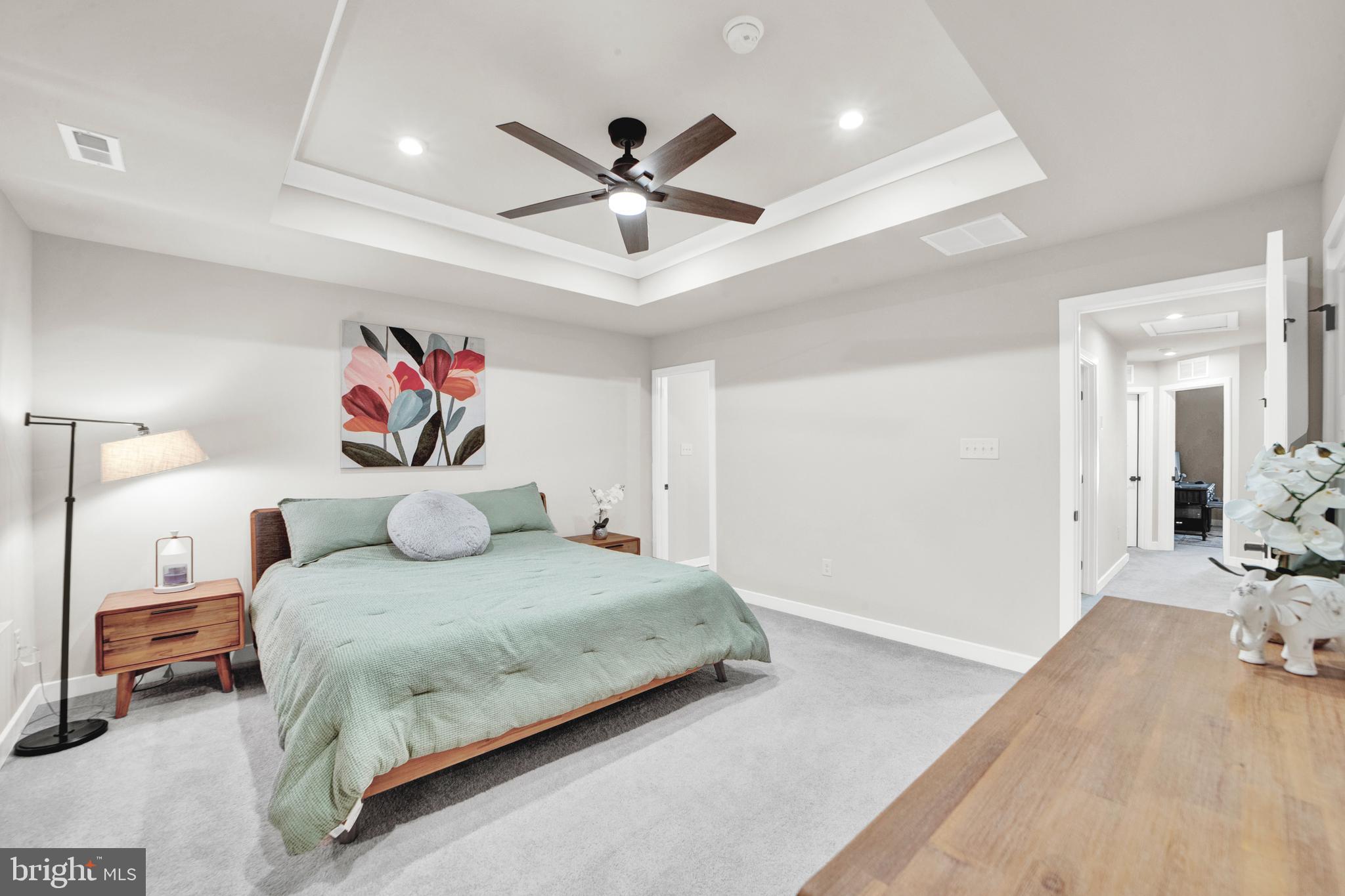 15 Pratt Lane Lawrence Township, NJ 08648 - Photo 15 of 31 a bedroom with a bed and a chandelier