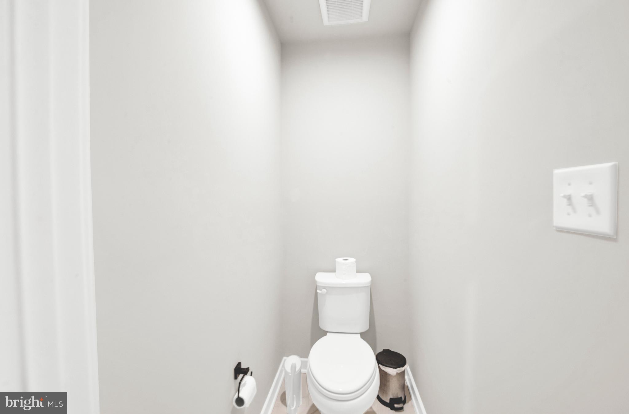 15 Pratt Lane Lawrence Township, NJ 08648 - Photo 17 of 31 a white toilet sitting next to a white wall