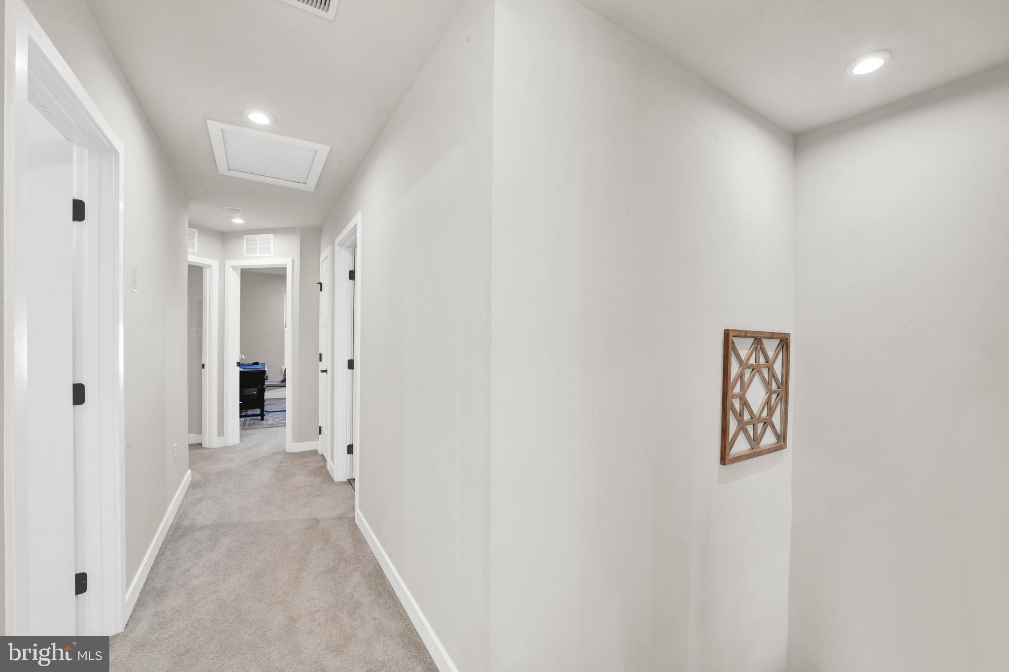 15 Pratt Lane Lawrence Township, NJ 08648 - Photo 18 of 31 a view of a hallway with wooden shelves