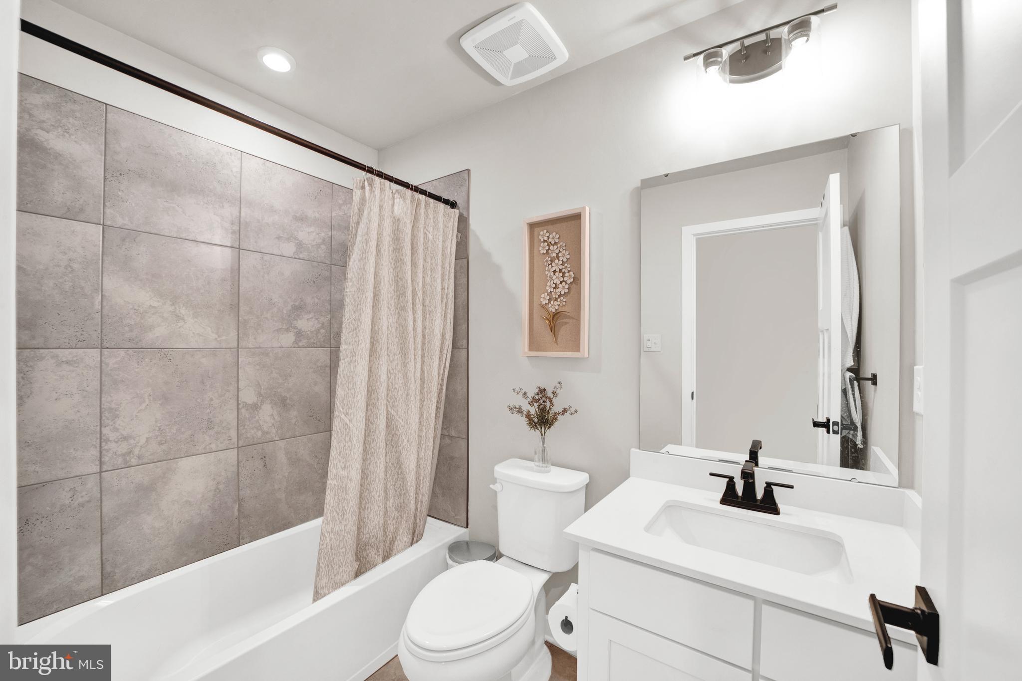 15 Pratt Lane Lawrence Township, NJ 08648 - Photo 21 of 31 a bathroom with a sink a toilet and shower