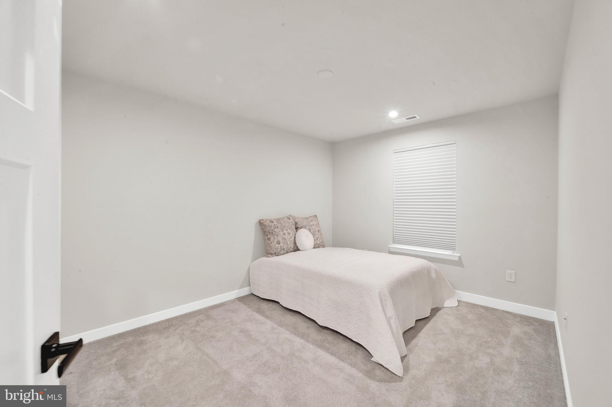 15 Pratt Lane Lawrence Township, NJ 08648 - Photo 22 of 31 a bedroom with a bed and a night stand