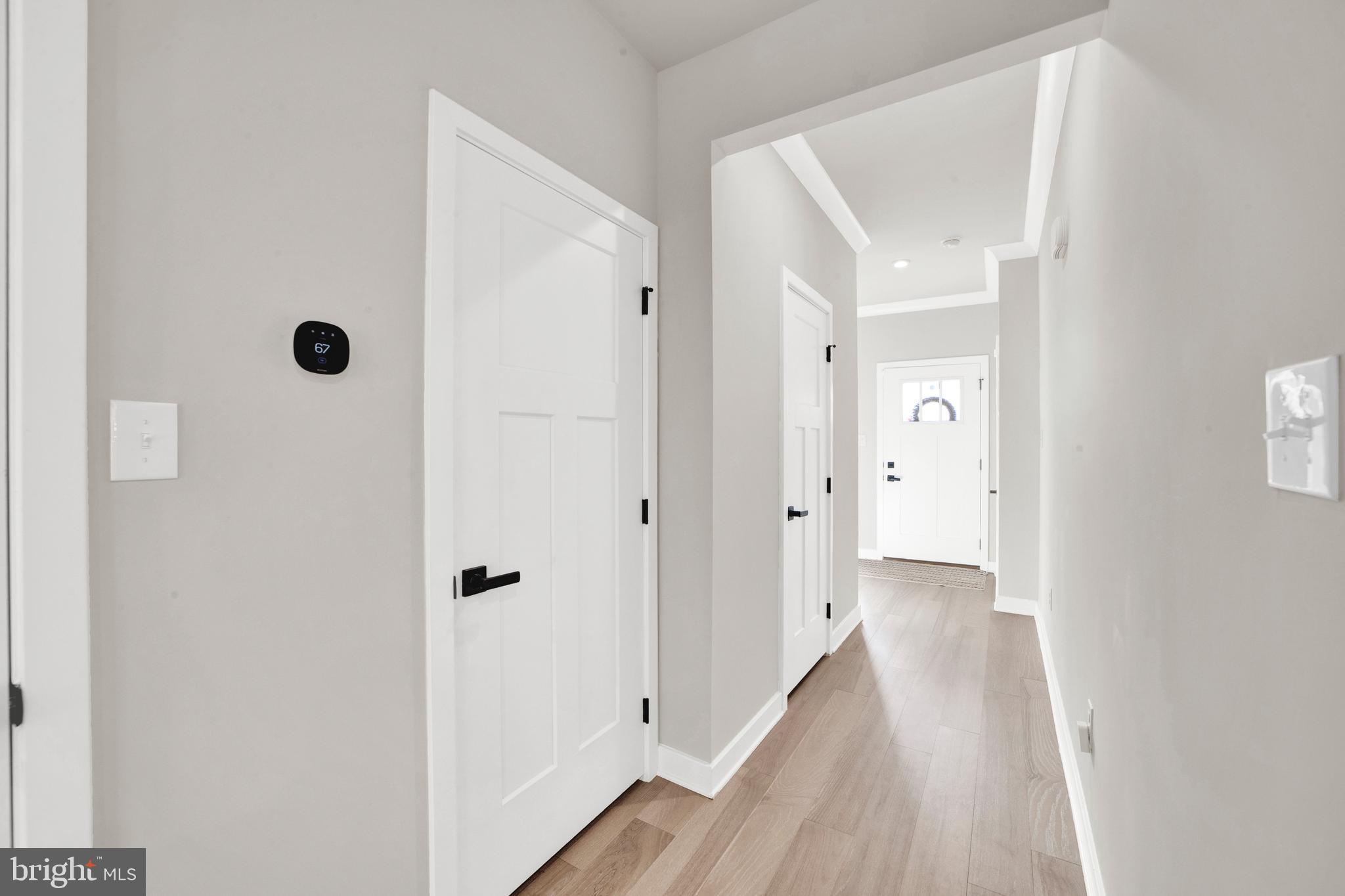 15 Pratt Lane Lawrence Township, NJ 08648 - Photo 3 of 31 a view of a hallway with wooden floor