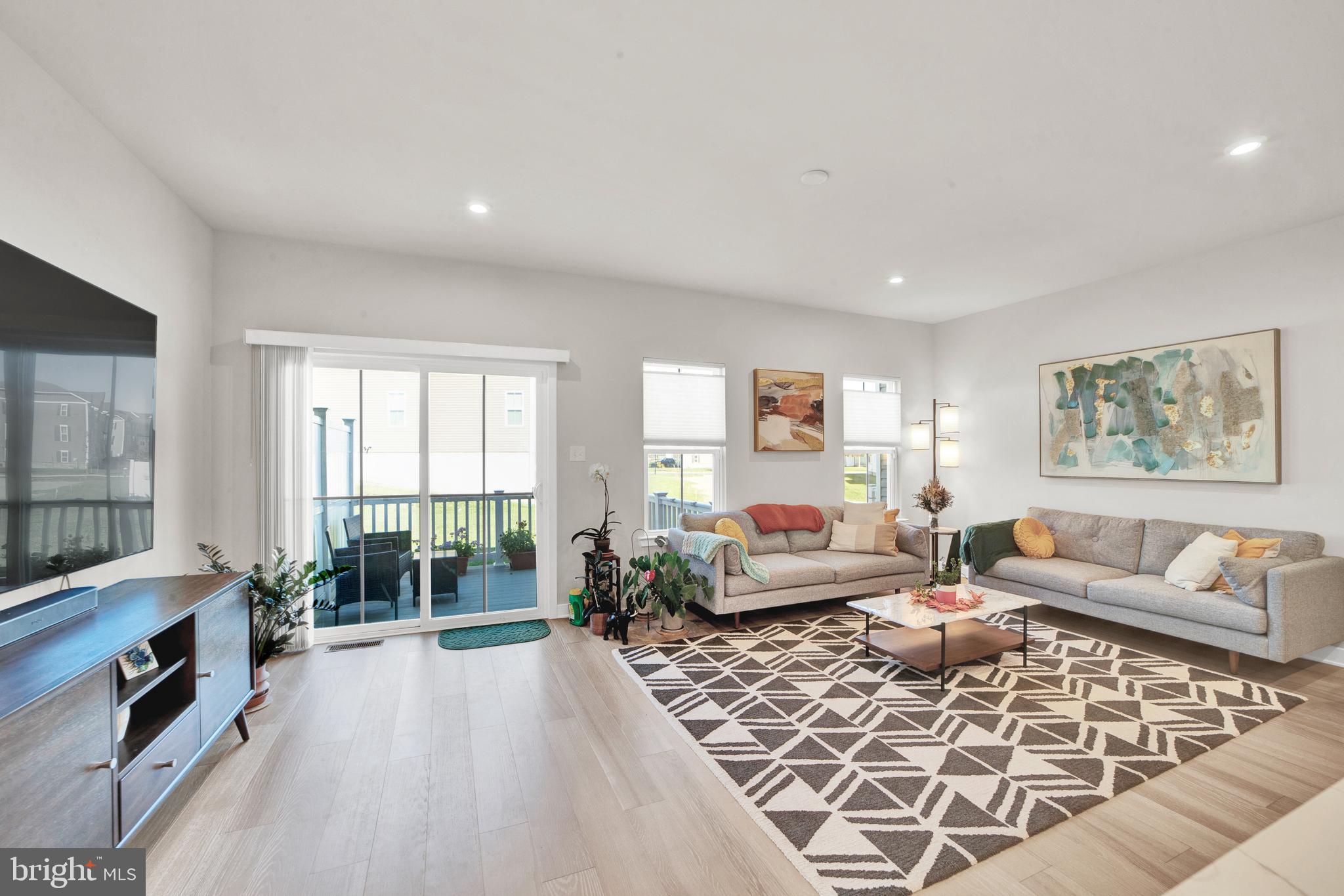15 Pratt Lane Lawrence Township, NJ 08648 - Photo 10 of 31 a living room with furniture large window and a fireplace