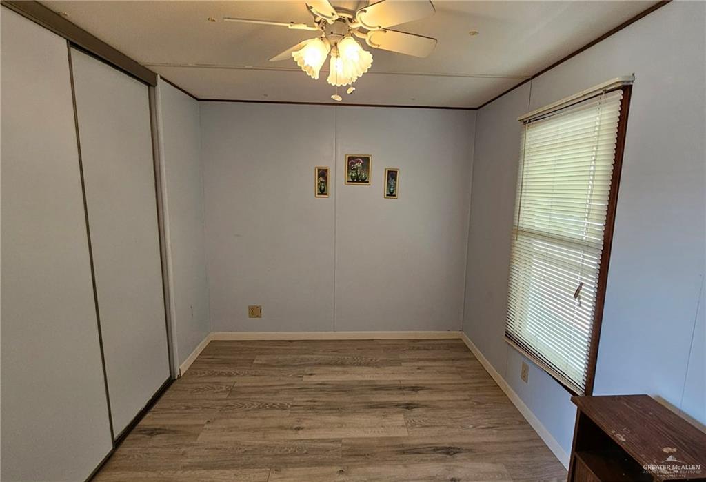 1905 Johnson Street Mission, TX 78572 - Photo 16 of 22 a view of room with window and hardwood floor