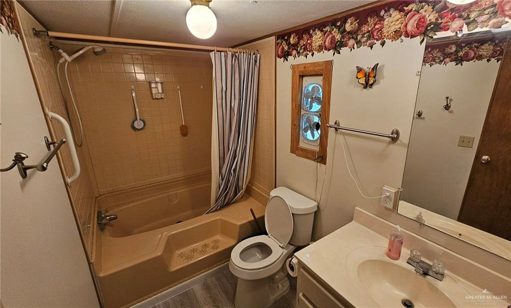 1905 Johnson Street Mission, TX 78572 - Photo 10 of 22 a bathroom with a sink toilet and shower
